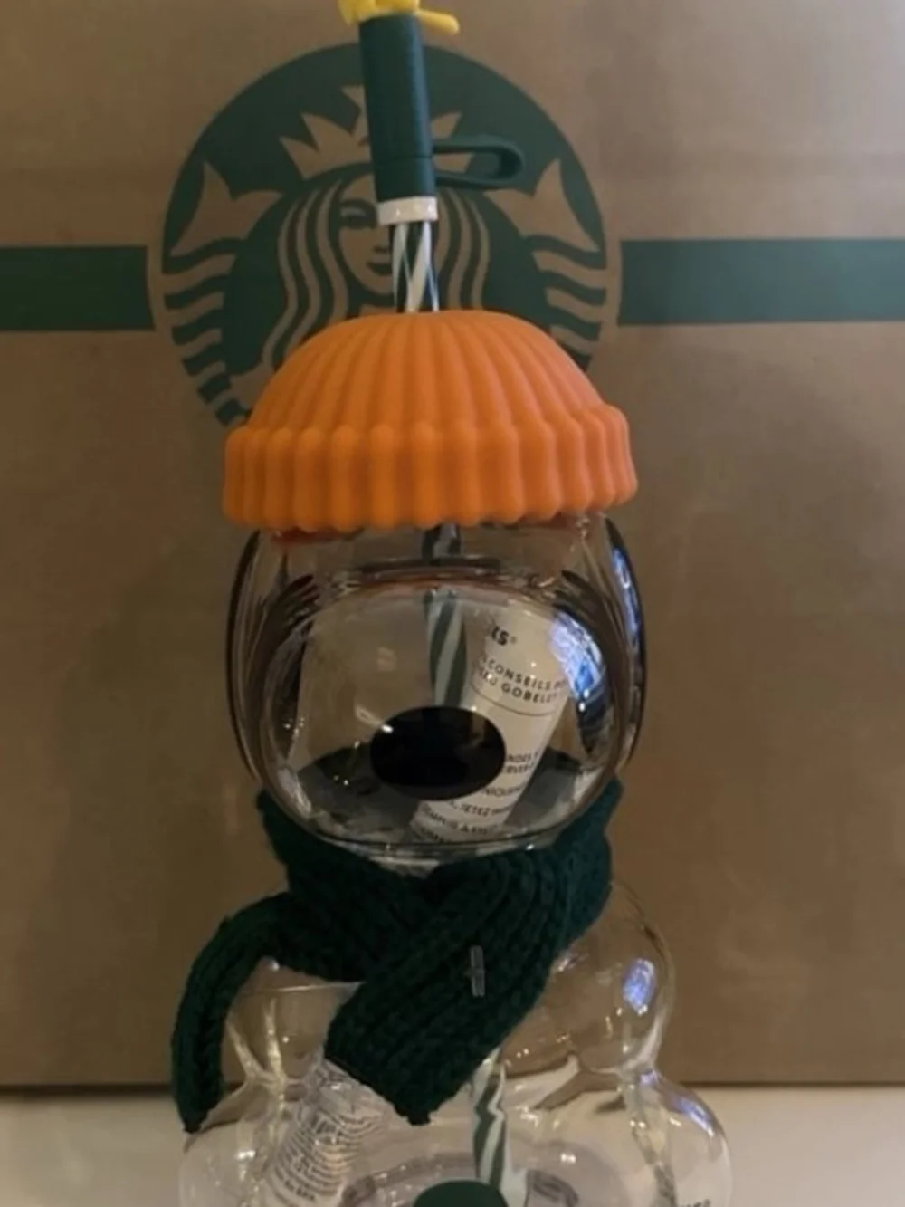 Starbucks Clear Glass Peanuts Snowman Cup with Orange Lid and Green Scarf